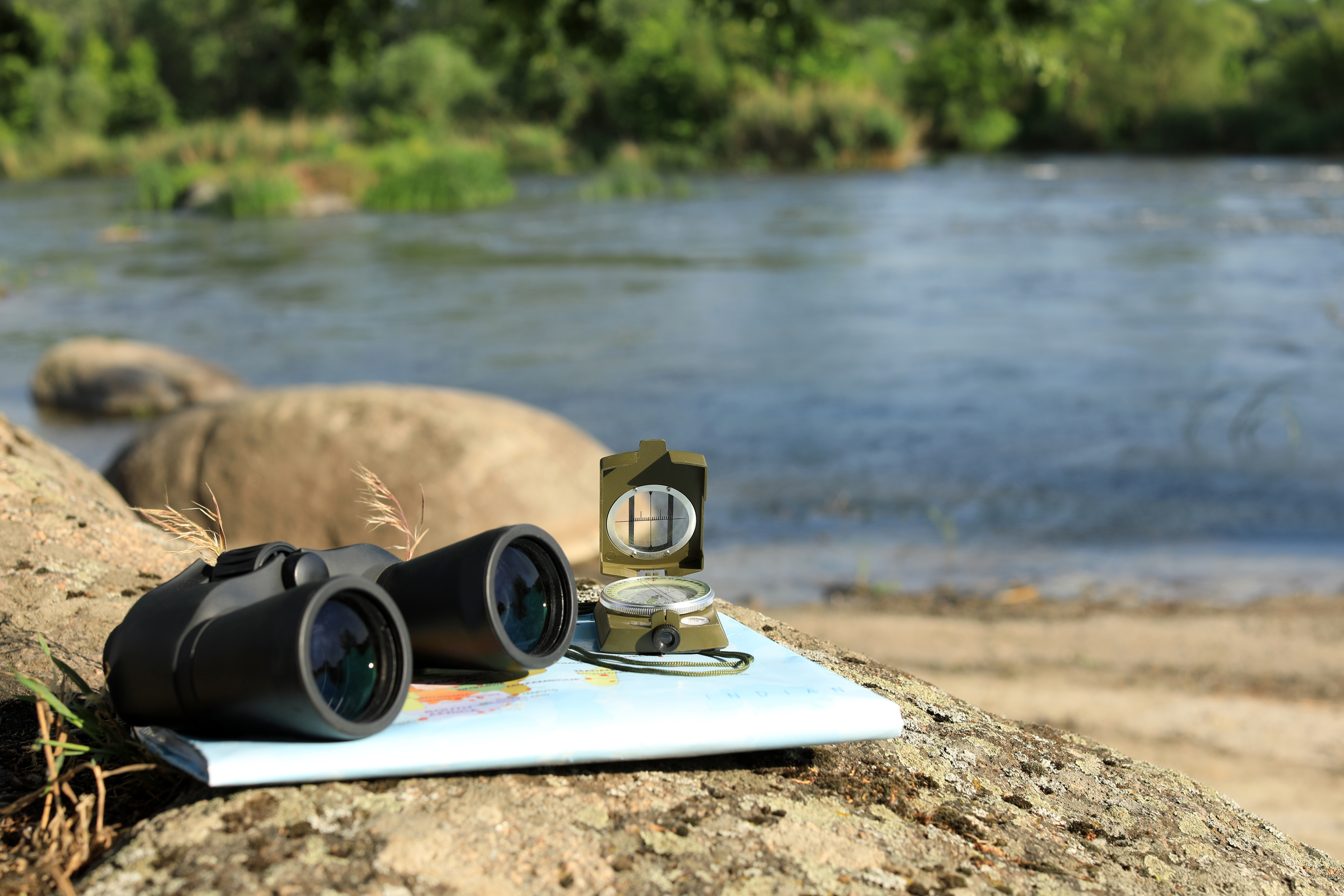 High-quality binoculars being used to spot wildlife on a luxury game drive in Tanzania's Serengeti National Park