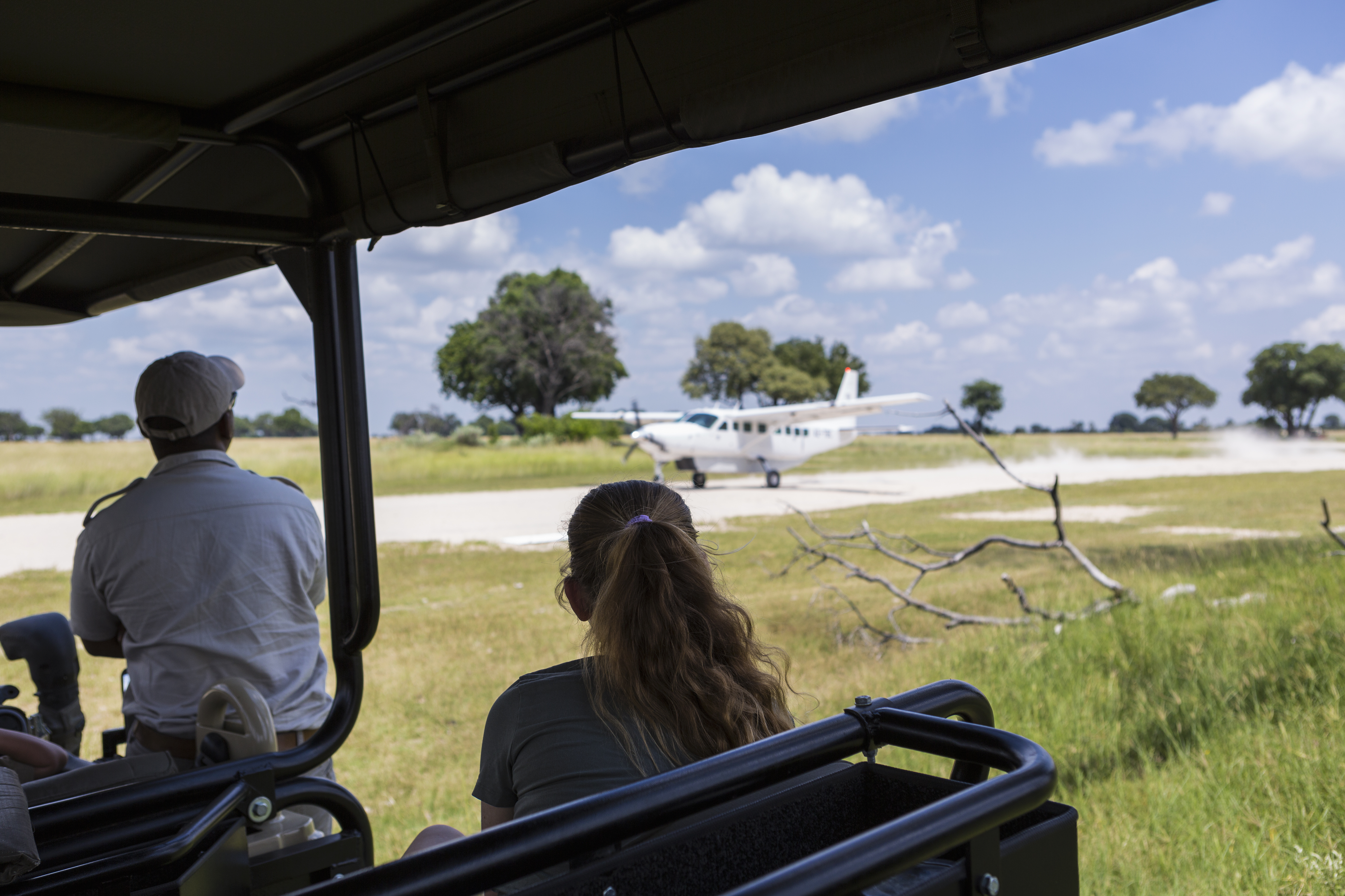 Small bush plane on a Serengeti airstrip ready for departure at sunrise