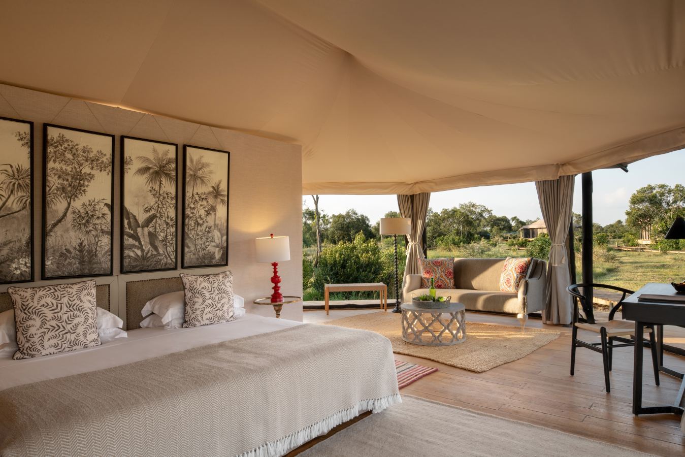 Exclusive-use luxury fly-camp at sunset in a private Serengeti concession