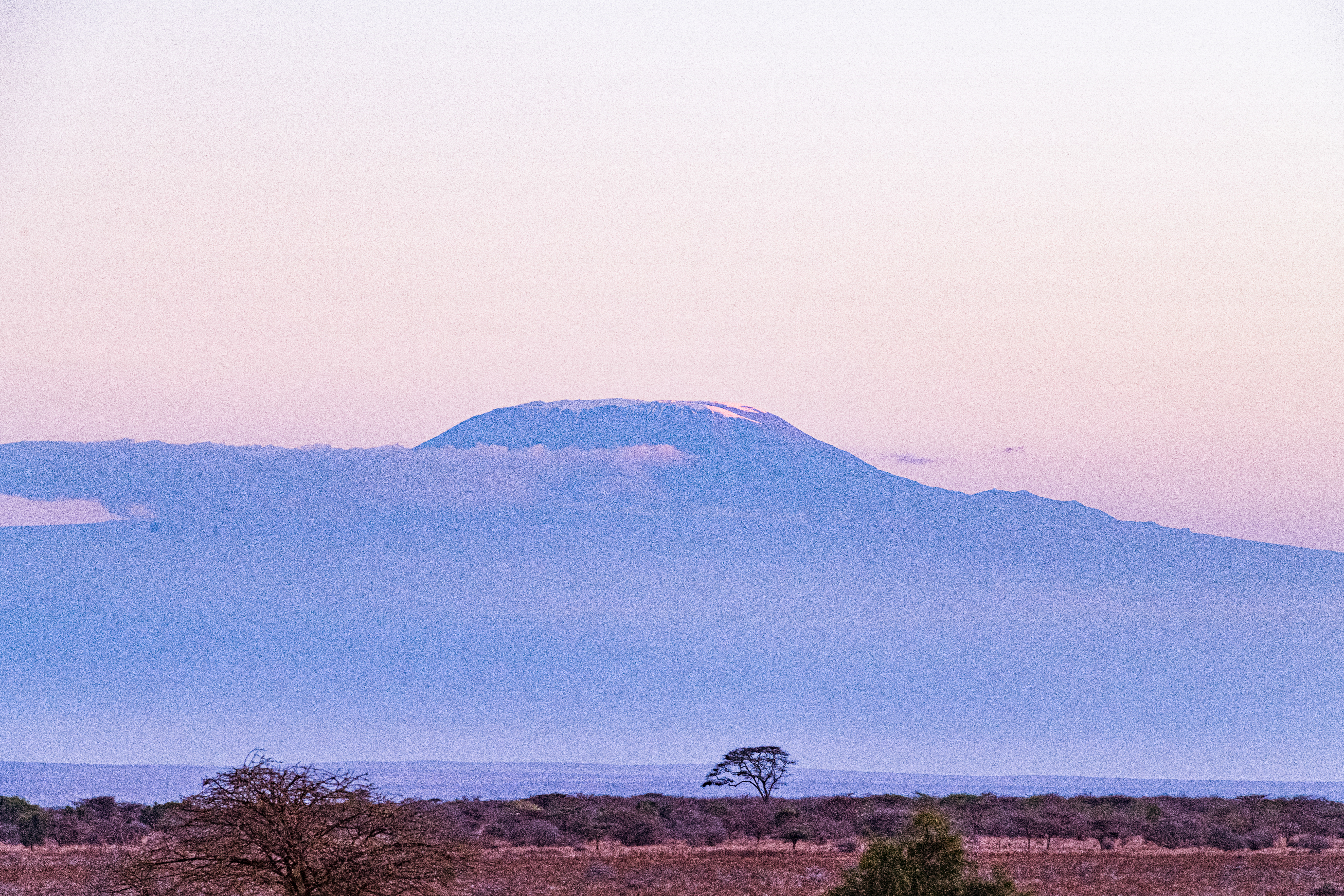 Mount Kilimanjaro at dawn, Tanzania's iconic landmark near the gateway airport for luxury northern circuit safaris