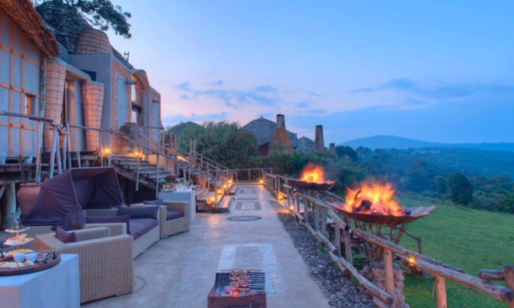 Luxury crater rim lodge in Tanzania's Ngorongoro Conservation Area with panoramic views over the caldera at dawn