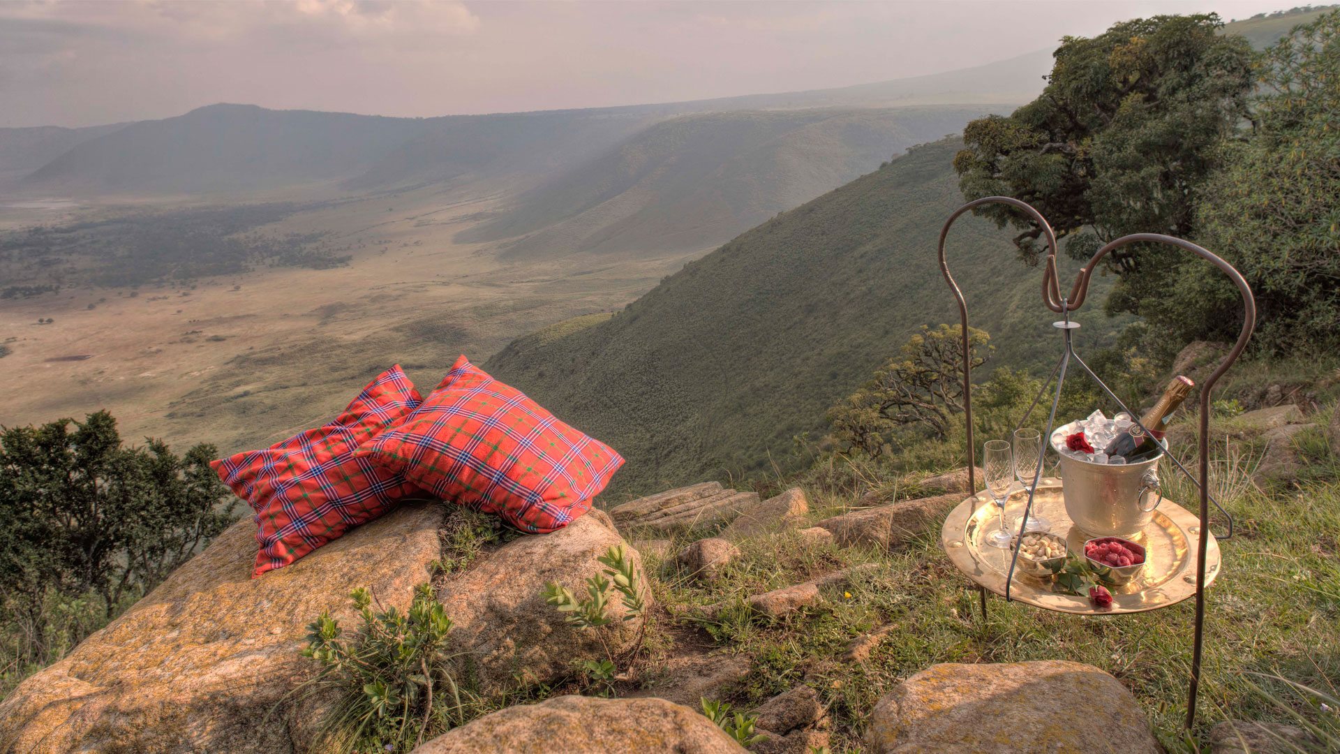 Permanent luxury lodge on the Ngorongoro crater rim in Tanzania with dramatic caldera views from the main terrace — the setting that defines crater rim lodge accommodation