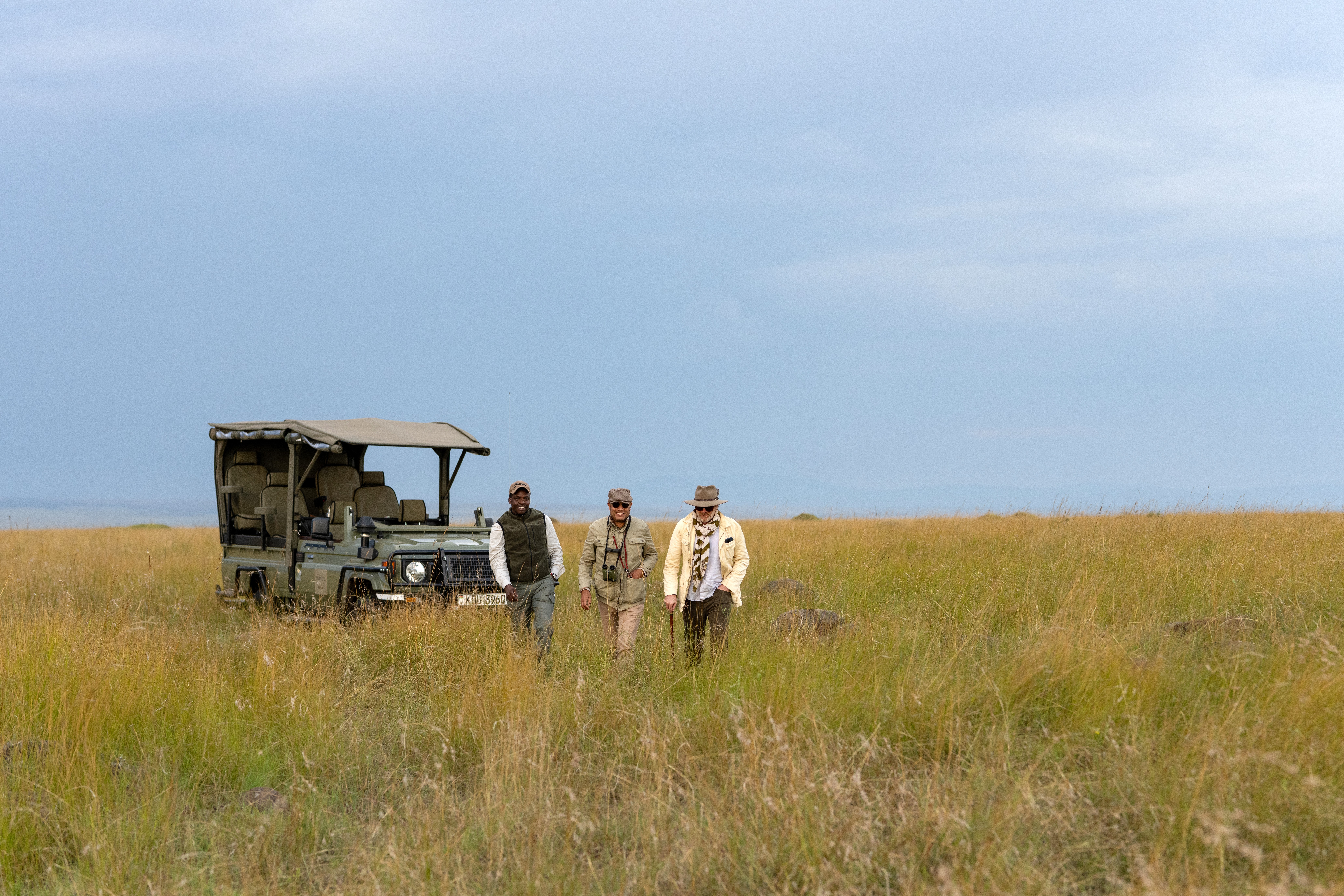 Private open-sided safari vehicle crossing the Serengeti plains on a luxury Tanzania safari