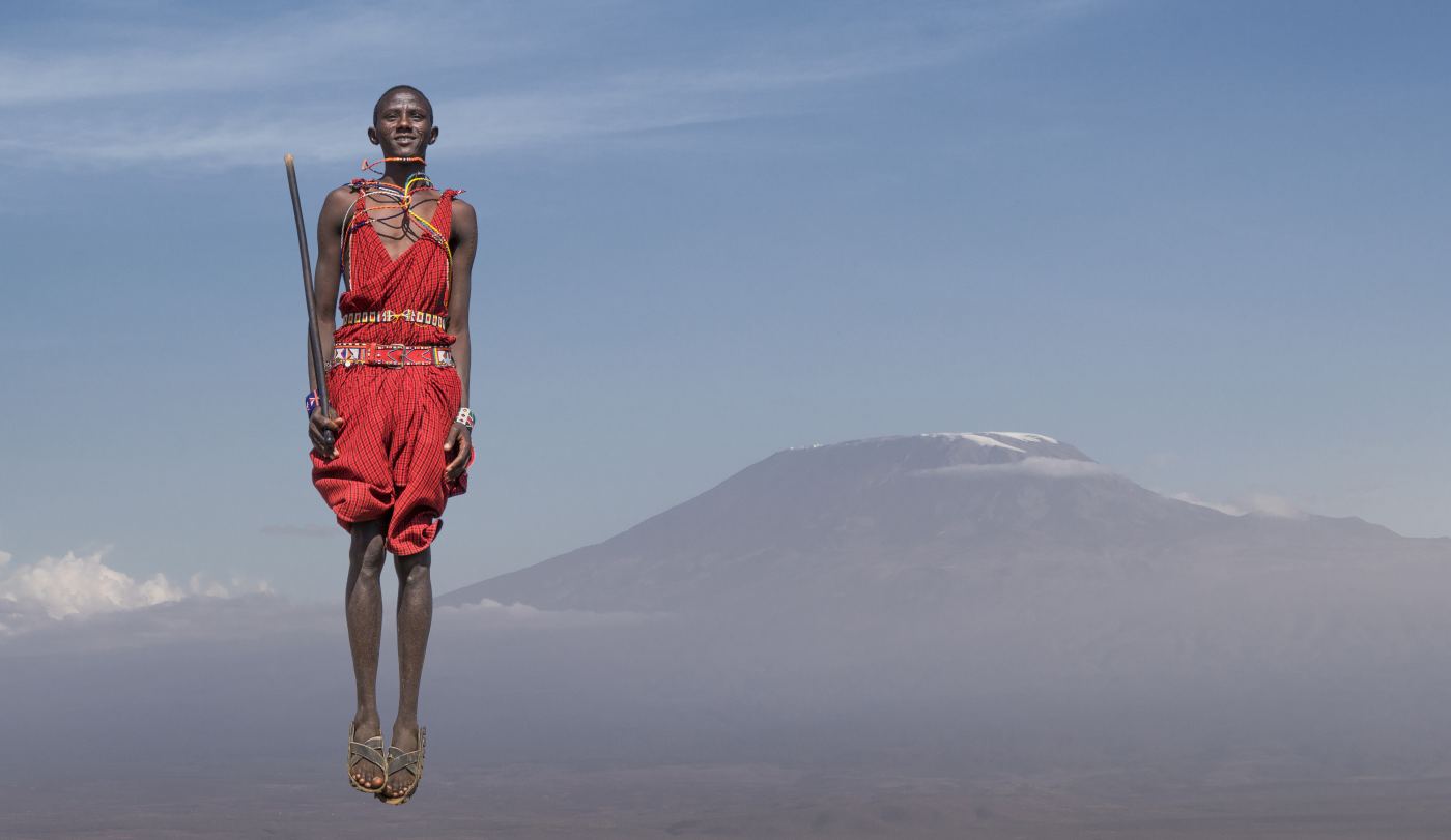 Guest arriving at a luxury tented camp in Tanzania being welcomed by staff