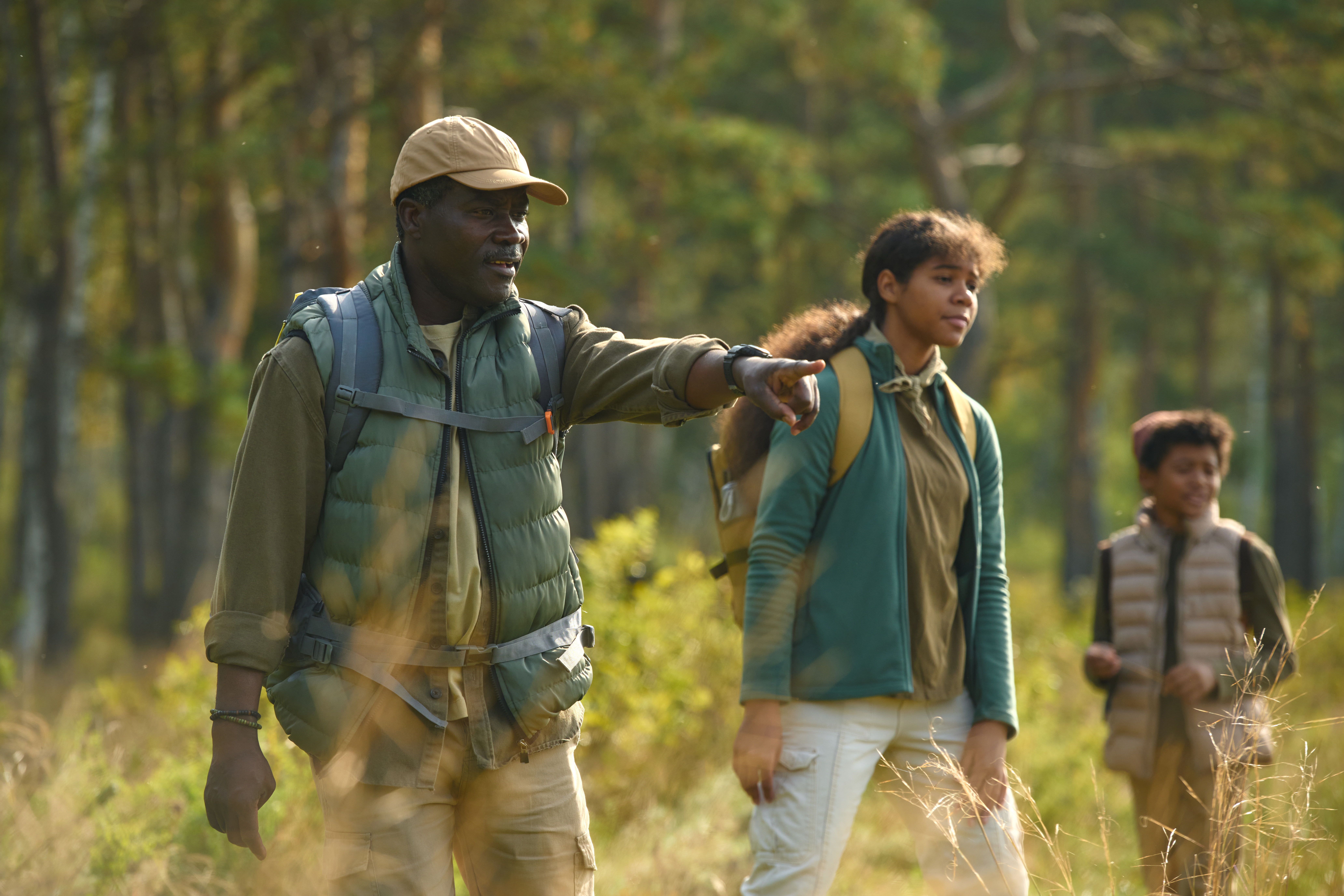 Guests on a guided walking safari in Tanzania's Ruaha National Park with an armed ranger tracking wildlife on foot in the remote southern wilderness